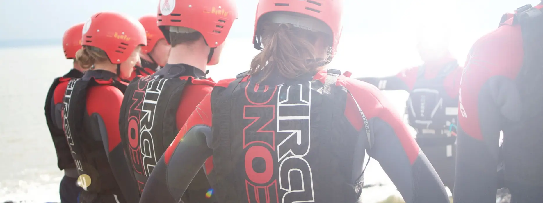 North Devon coasteering guide briefing a group before entering the water