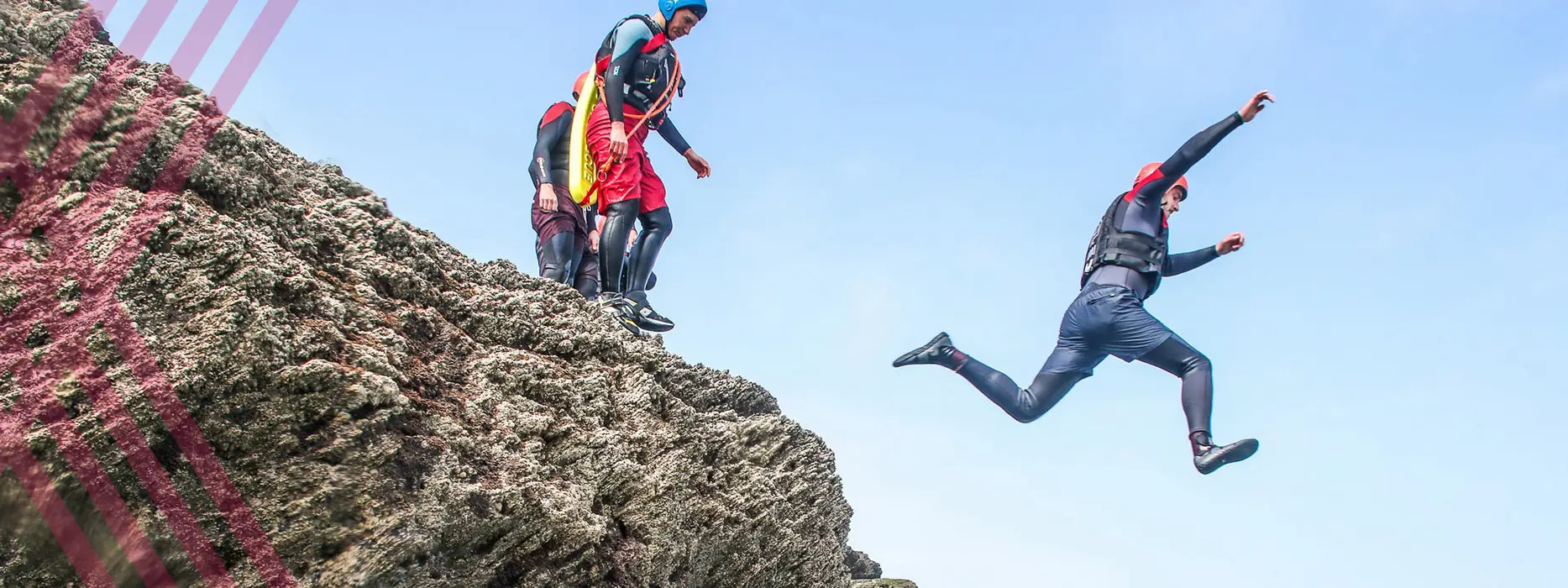 Safely jumping from Rocks at Croyde Coasteering Jumping from Rocks at Croyde Coasteering